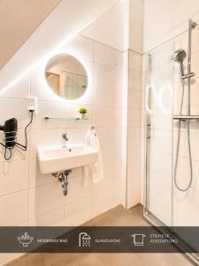 a bathroom with a sink and a shower at Ort 245 in Ried im Innkreis +13 photos