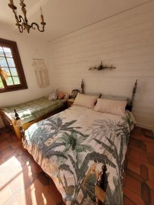 a bedroom with a large bed in a room at Le souffle des montagnes in Levens
