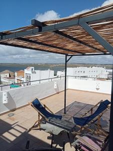 two chairs on the roof of a house at Casa Victoire Ayamonte in Ayamonte