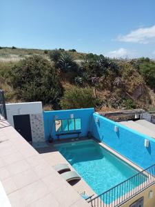 a swimming pool on the roof of a building at Casa Victoire Ayamonte in Ayamonte