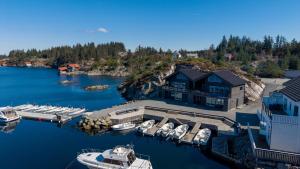 an aerial view of a marina with boats in the water at Eksklusiv Rorbu - Havblikk 1 - Båtutleie in Bekkjarvik