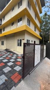 a building with a gate in front of it at G10 & 12 - Sabari Enclave Premium One bedroom Apartment in Trivandrum