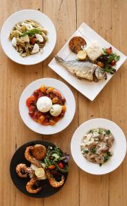 a group of plates of food on a wooden table at L'Echo des Montagnes Armoy in Armoy