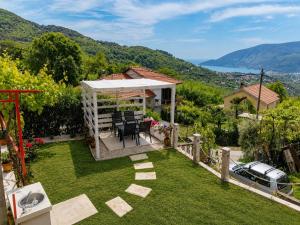 a house with a garden with a view at Seaview Chalet in Herceg-Novi
