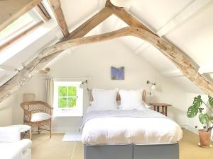 a bedroom with a bed in the attic at The Attic Apartment, Quay Street Studios Cardigan in Cardigan