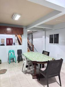 a dining room with a table and chairs at Zari zara Apartment in San Simon