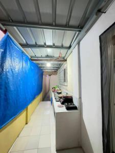 a room with a kitchen with a stove in it at Zari zara Apartment in San Simon