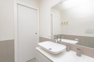 a bathroom with a sink and a mirror at CityLife in Bergamo