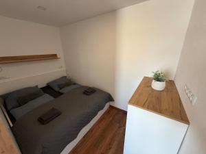 a small room with two beds and a counter at Modern stylish apartment in Prievidza