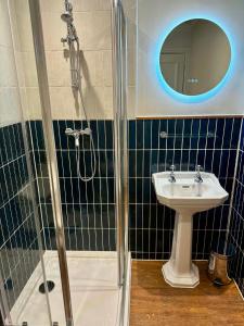 a bathroom with a shower and a sink at George Hotel & Granary in Frome +92 photos