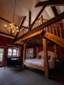 a bedroom with a bunk bed with a ladder at Askham Hall in Askham +150 photos