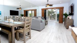 a living room with a dining table and a couch at 409 Mariners Club in Key Largo