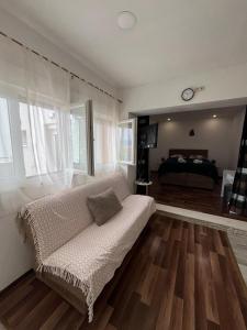 a living room with a couch and a bed at JUDITA in Omiš +50 photos