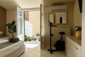 a bedroom with a door open to a patio at Casa Regina, nice position! in Alba +22 photos