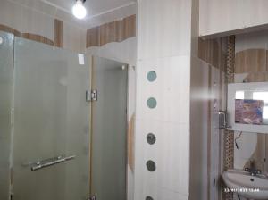 a bathroom with a shower and a sink at Sky Roof Suite in Marsa Alam City +51 photos