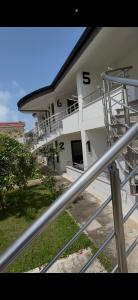 a building with a spiral staircase in front of it at Hasler Studios in Qerret +3 photos