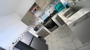 an overhead view of a kitchen with a stove and a sink at Mombasa city view in Mombasa