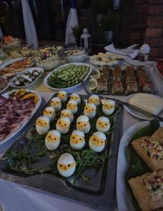a table full of food with eggs and other foods at Ośrodek Wypoczynkowy Niagara in Międzybrodzie Żywieckie