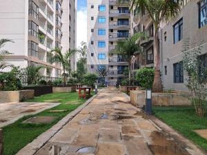 an empty street in a city with tall buildings at Quick Connect Studio Kileleshwa in Nairobi