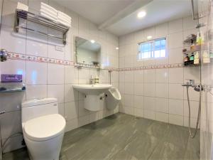 a bathroom with a toilet and a sink at 歐森View包棟Villa x 雲海夜景 x 獨立空間 in Dongshi