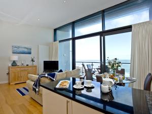 a kitchen and living room with a view of the ocean at Bliss - Horizon View in Westward Ho
