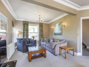 a living room with a couch and a table at Mount Pleasant in Threlkeld