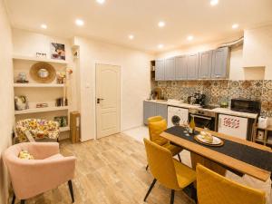 a kitchen and dining room with a table and chairs at NDK - Dream House in Sofia