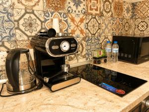 a kitchen counter with a blender and a toaster at NDK - Dream House in Sofia