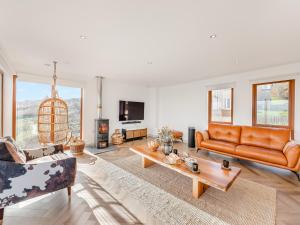 a living room with a couch and a table at The Beaches in Berwick-Upon-Tweed