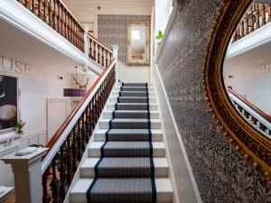 a staircase in a house with a mirror at Croft House - Uk7555 in Inverness