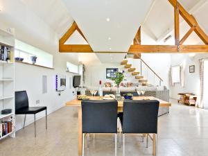 a kitchen and dining room with a table and chairs at Antells Farm Barn in Sturminster Newton