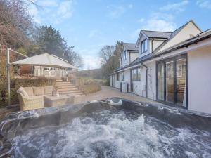 a swimming pool in the backyard of a house at Amaranth in Shurdington