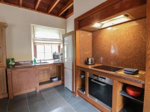 a kitchen with a sink and a counter top at Duck Pond- Uk7232 in Kirkmichael