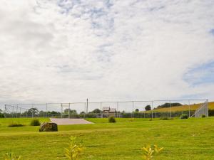 a fence in a field with a skate park at The Stable - Om4 in Mydroilin