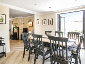 a kitchen and dining room with a table and chairs at Garth End in Appleby +21 photos