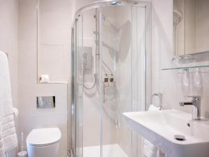 a bathroom with a shower and a toilet and a sink at Tree House - Uk7556 in Inverness +11 photos