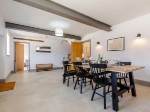 a dining room with a table and chairs at The Hayloft - Uk34565 in Whitchurch
