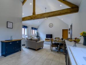 a kitchen and living room with a table and chairs at The Wheat Store - Uk32649 in Elston +22 photos