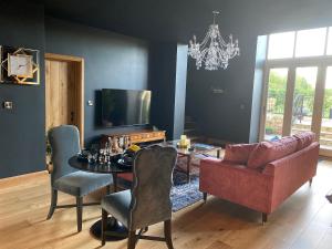 a living room with a couch and a table with a couch at The Richmond - Uk40459 in Newsham