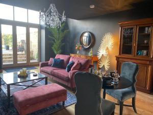 a living room with a pink couch and a table at The Richmond - Uk40459 in Newsham