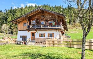 a log house with a balcony on top of it at Charmantes Ferienhaus in Schwendt