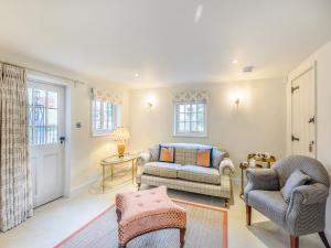 a living room with two chairs and a couch at Halton Lodge in Halton Holegate