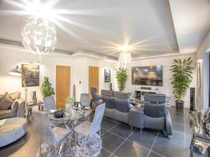 a living room with a table and chairs at The Paddocks Retreat in North Thoresby