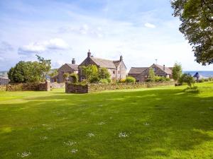 a group of houses on a grassy field at Birch Cottage - Uk4185 in Hazlehead Bridge +12 photos