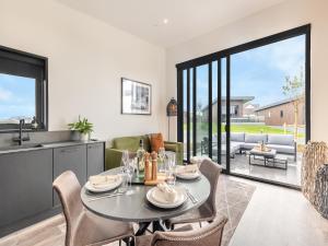 a dining room with a table and chairs at Seiriol Lodge 4 - Uk42794 in Llangefni