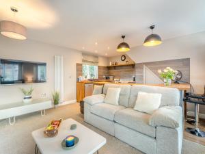 a living room with a couch and a table at Dower House Lodge in Ludlow