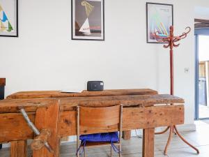 a wooden desk with a chair and a lamp at The Cart Arms in Gloucester