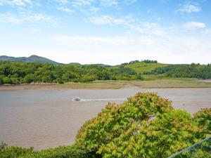 a boat in the water on a river at Berkeley in Kippford