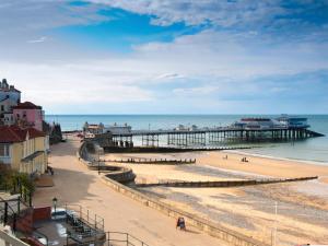 a view of a beach with a pier at The Granary Store in Woodrising