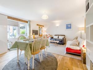 a living room with a table and chairs at The Granary Store in Woodrising +13 photos